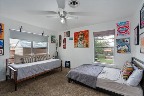 a bedroom with a bed and a couch