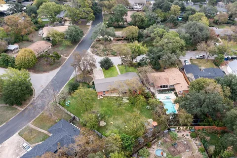 an aerial view of house with yard