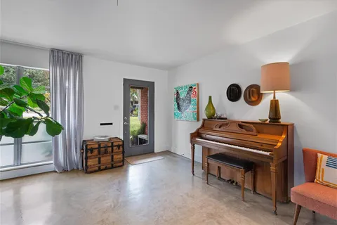 a bedroom with furniture and a chair