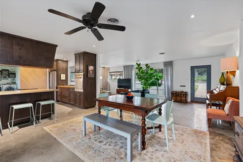 a living room with furniture a window and a table