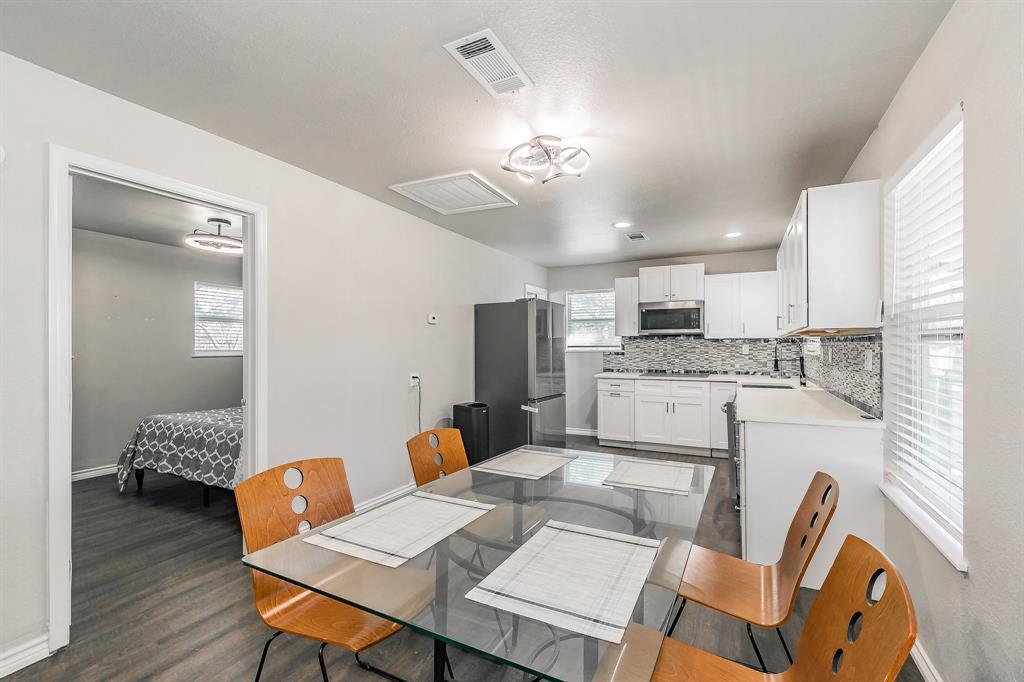 7612 Sommerville Place Road Fort Worth, TX 76135 - Photo 11 of 37 a view of kitchen with cabinets and wooden floor