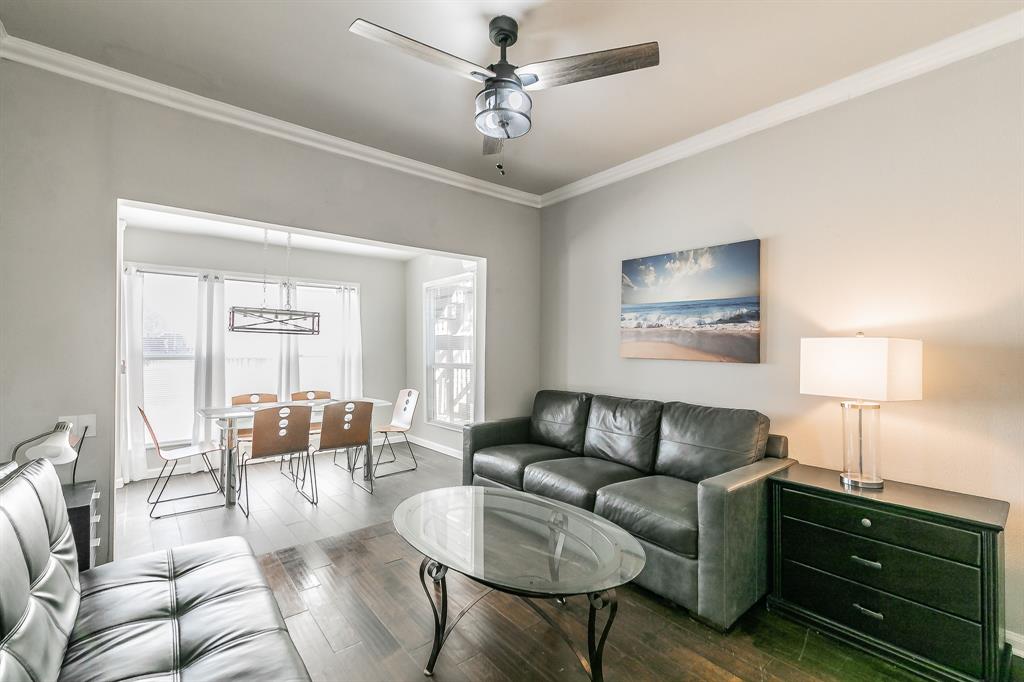 7612 Sommerville Place Road Fort Worth, TX 76135 - Photo 12 of 37 a living room with furniture a ceiling fan and a window