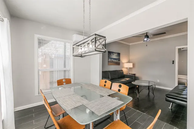 a living room with furniture a couch and a lamp