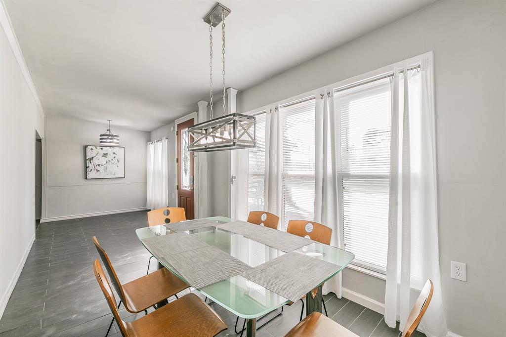 7612 Sommerville Place Road Fort Worth, TX 76135 - Photo 17 of 37 a view of a dining room with furniture window and outside view