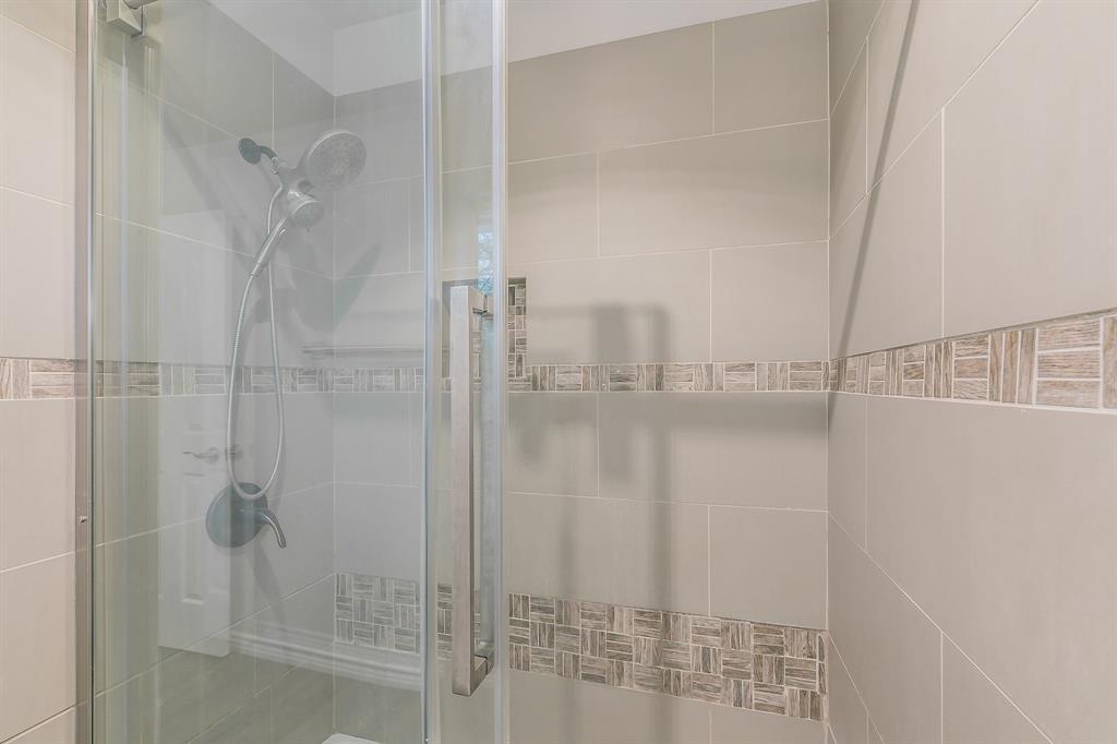 7612 Sommerville Place Road Fort Worth, TX 76135 - Photo 19 of 37 a bathroom with a shower