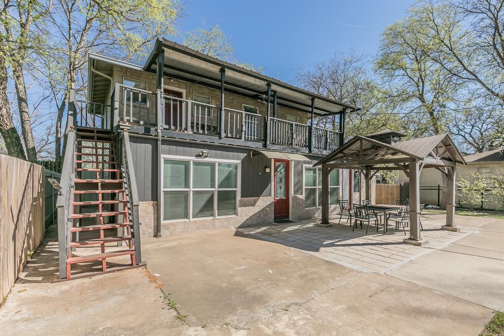 7612 Sommerville Place Road Fort Worth, TX 76135 - Photo 2 of 37 a view of a building with a outdoor space