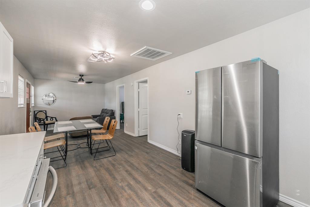 7612 Sommerville Place Road Fort Worth, TX 76135 - Photo 22 of 37 a work room with furniture wooden floor and a ceiling fan