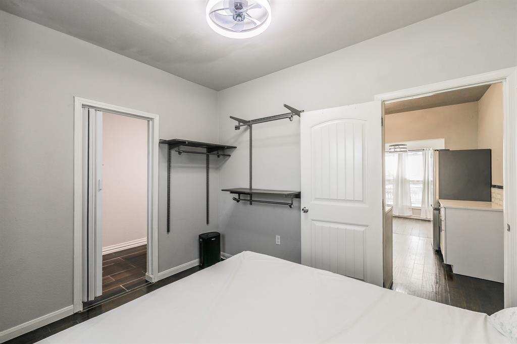 7612 Sommerville Place Road Fort Worth, TX 76135 - Photo 28 of 37 a bathroom with a shower and a room