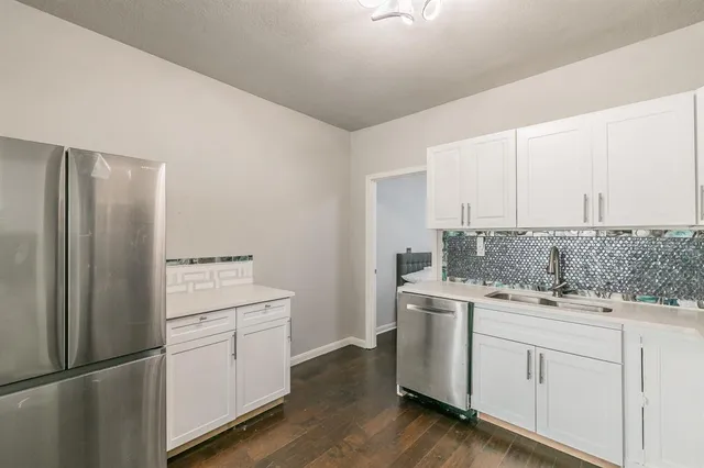 a bathroom with a sink and shower