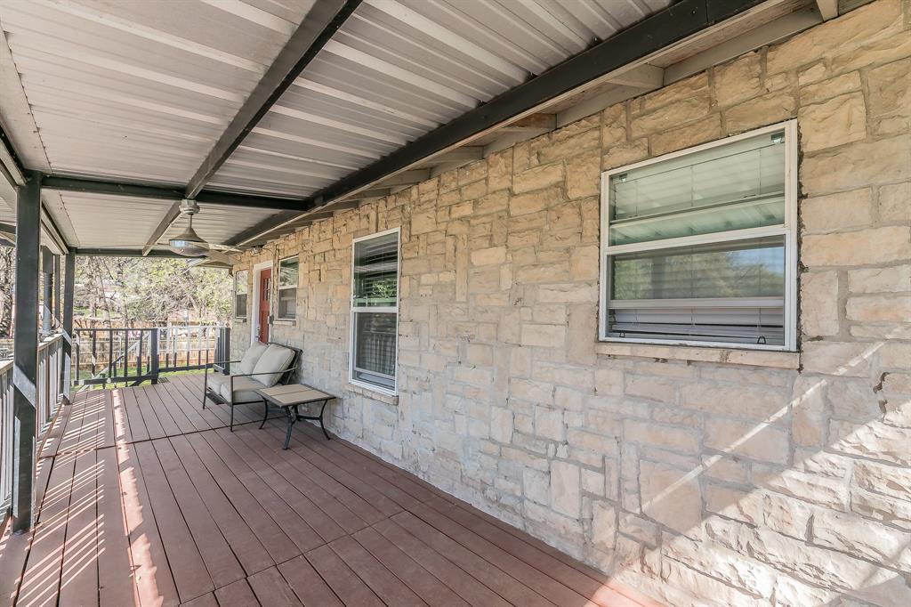 7612 Sommerville Place Road Fort Worth, TX 76135 - Photo 5 of 37 a balcony with chairs and wooden floor