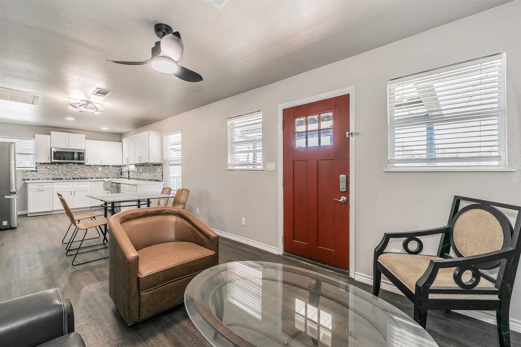 7612 Sommerville Place Road Fort Worth, TX 76135 - Photo 7 of 37 a living room with furniture and kitchen view