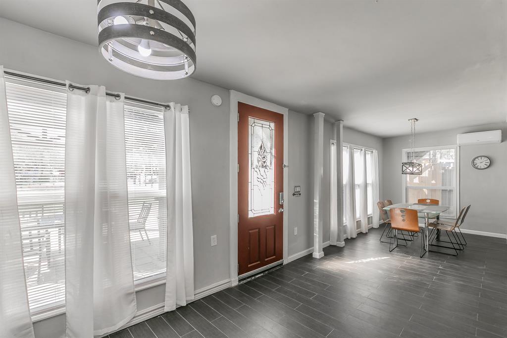 7612 Sommerville Place Road Fort Worth, TX 76135 - Photo 8 of 37 a view of a livingroom with wooden floor and a window