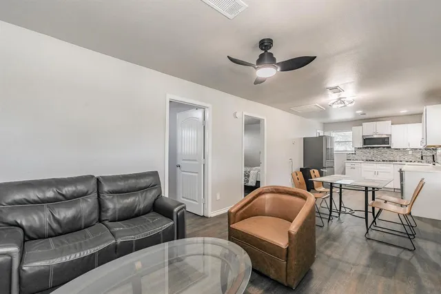 a view of kitchen with cabinets and wooden floor