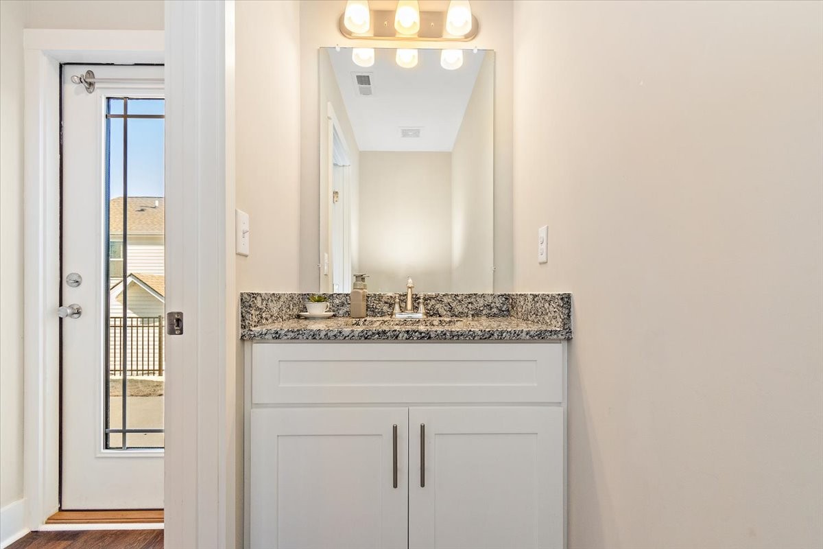 7000 Magnolia Crossings Spring Hill, TN 37174 - Photo 12 of 32 a bathroom with a sink and a mirror