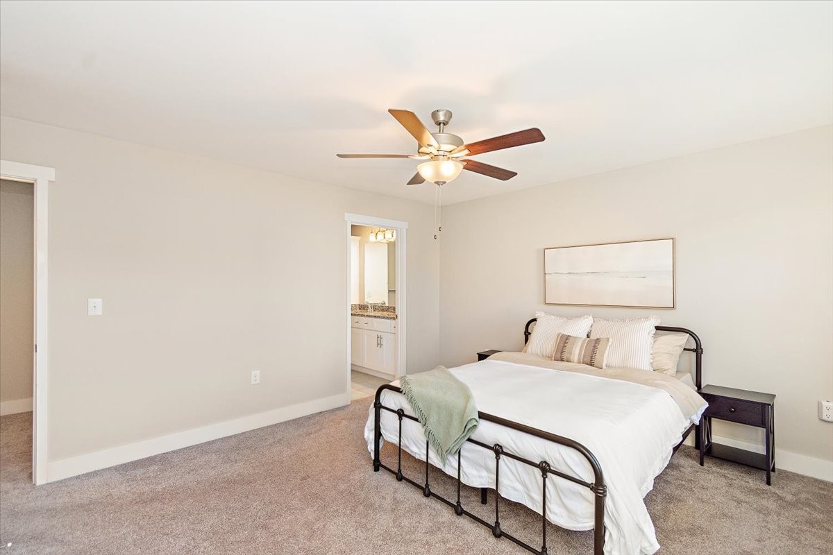 7000 Magnolia Crossings Spring Hill, TN 37174 - Photo 17 of 32 a bedroom with a bed and a ceiling fan