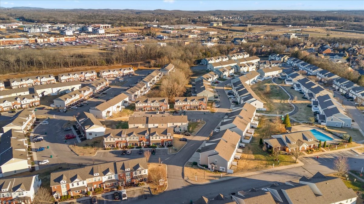 7000 Magnolia Crossings Spring Hill, TN 37174 - Photo 31 of 32 an aerial view of residential houses with outdoor space