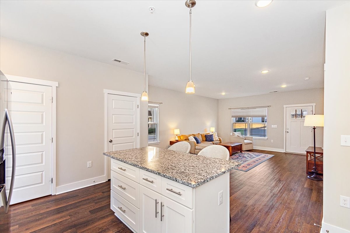 7000 Magnolia Crossings Spring Hill, TN 37174 - Photo 10 of 32 a open kitchen with stainless steel appliances granite countertop a refrigerator a sink dishwasher and a wooden floor