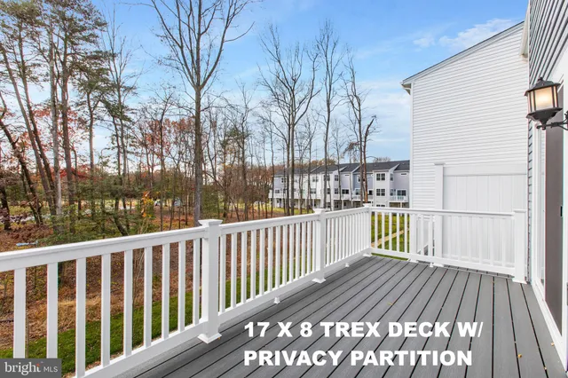 a view of balcony with wooden floor