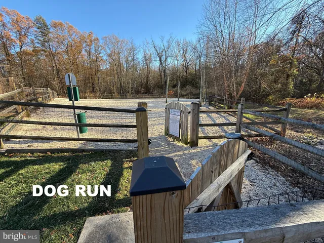 a view of a wooden deck with a yard