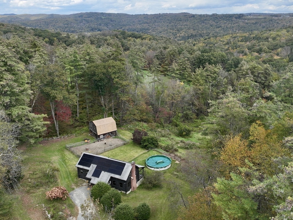 42 Shelburne Line Road Colrain, MA 01340 - Photo 1 of 41 a view of a backyard with plants and a garden