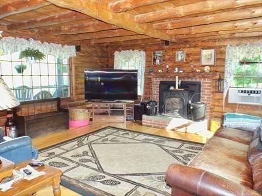 42 Shelburne Line Road Colrain, MA 01340 - Photo 14 of 41 a living room with furniture and a flat screen tv