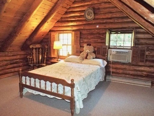 42 Shelburne Line Road Colrain, MA 01340 - Photo 19 of 41 a bedroom with a bed a dresser and windows