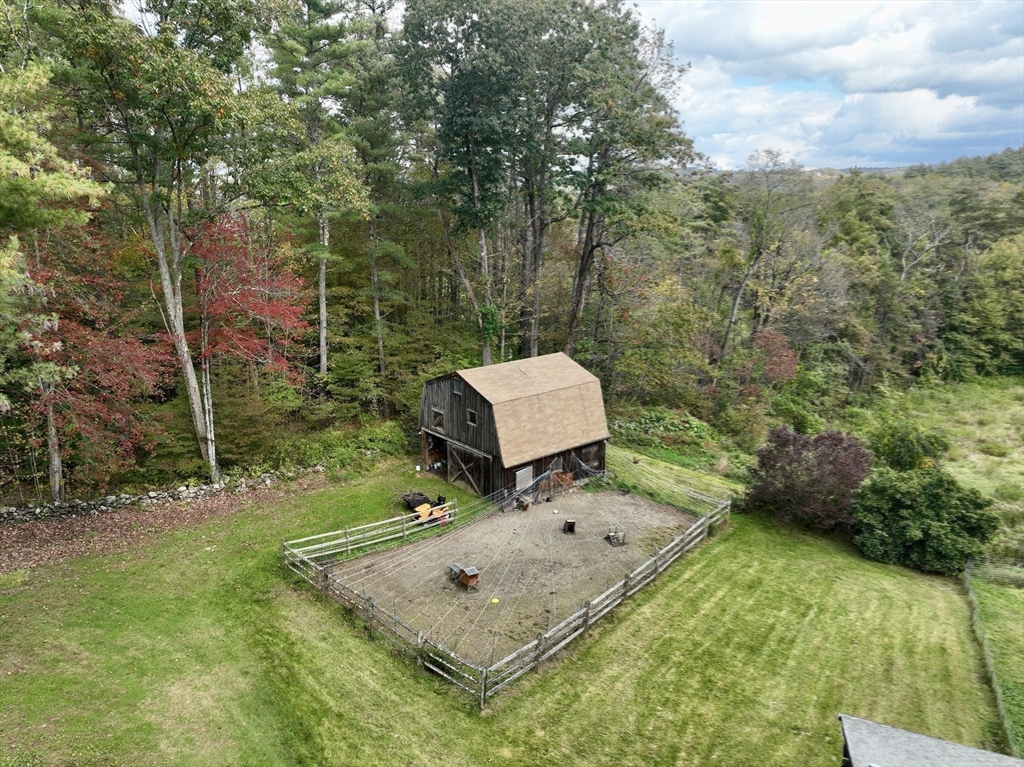 42 Shelburne Line Road Colrain, MA 01340 - Photo 25 of 41 a view of a two chairs in a backyard