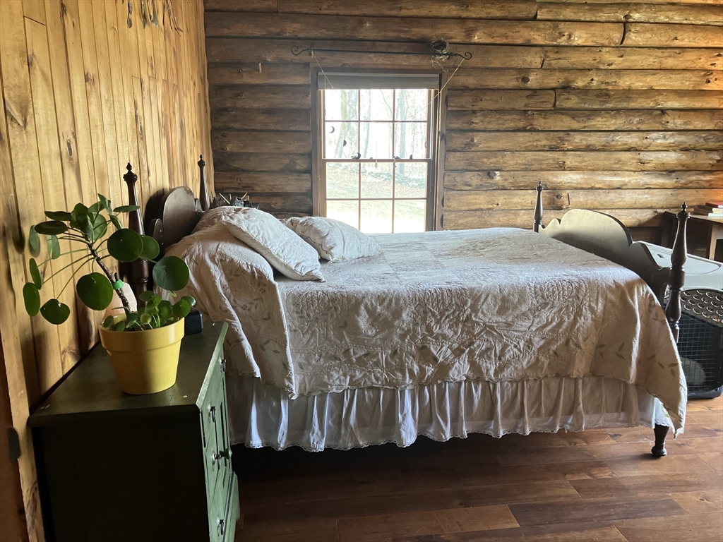 42 Shelburne Line Road Colrain, MA 01340 - Photo 8 of 41 a bedroom with a bed and a window