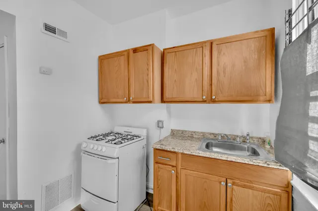 a view of storage and utility room with two washing machine