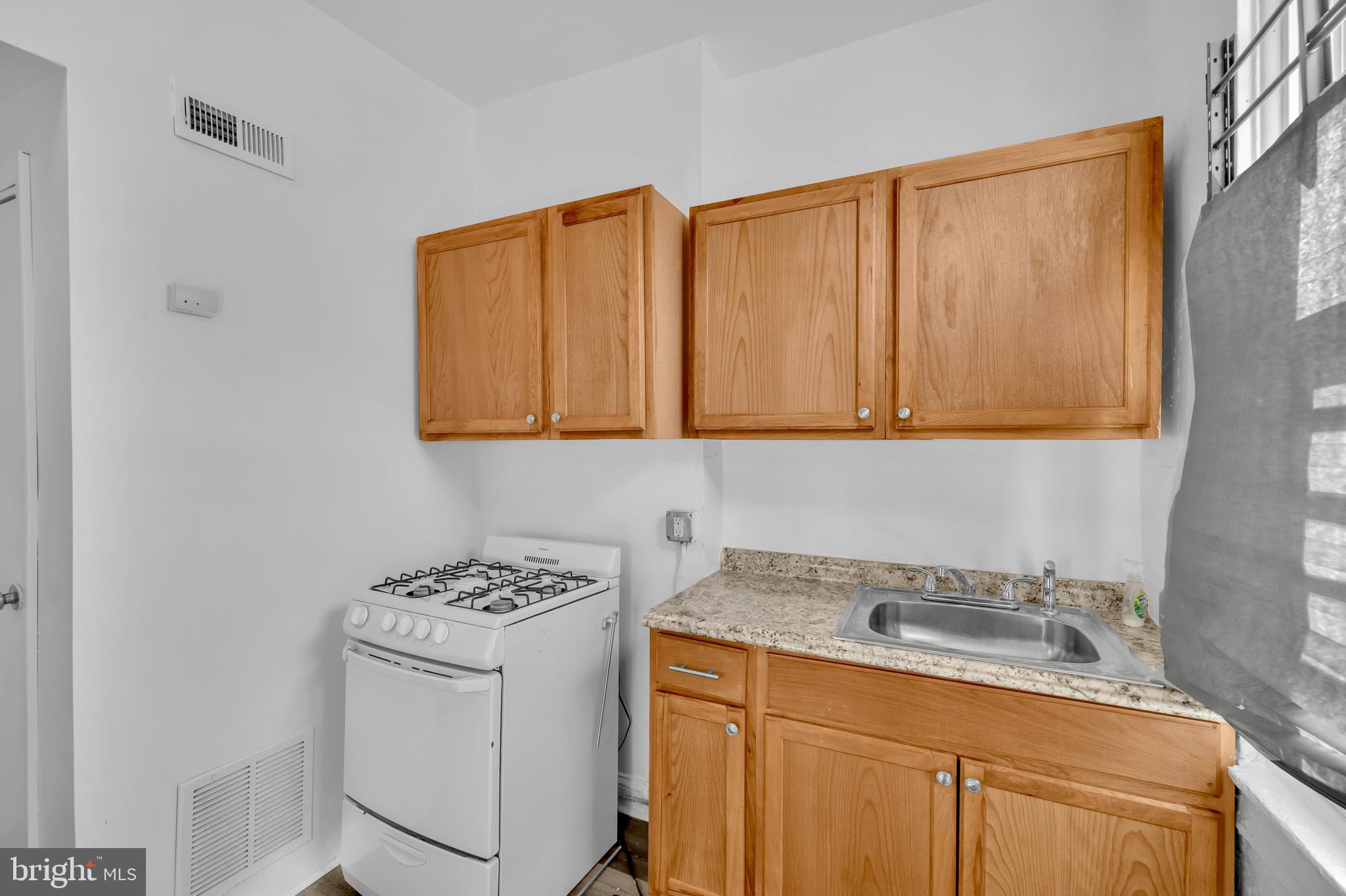 2920 Parkwood Avenue, Unit 2 Baltimore, MD 21217 - Photo 8 of 9 a view of storage and utility room with two washing machine