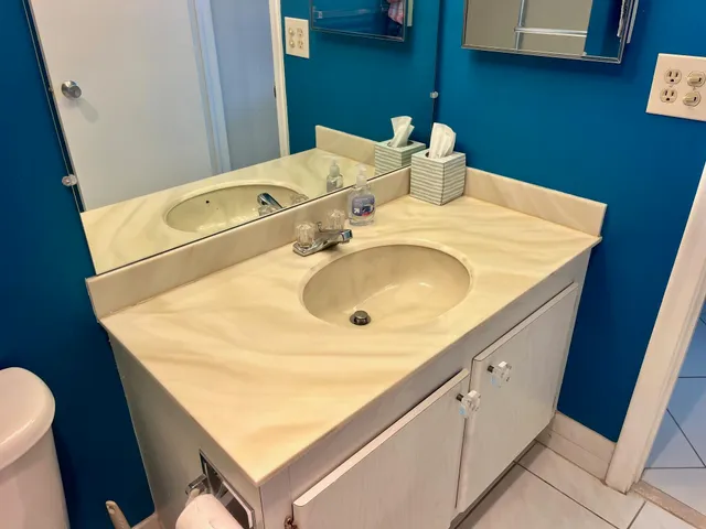 a bathroom with a sink and a mirror