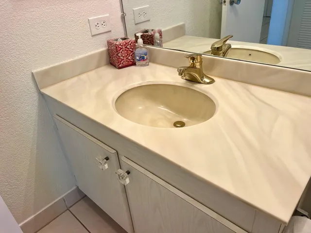 a bathroom with a sink and a mirror