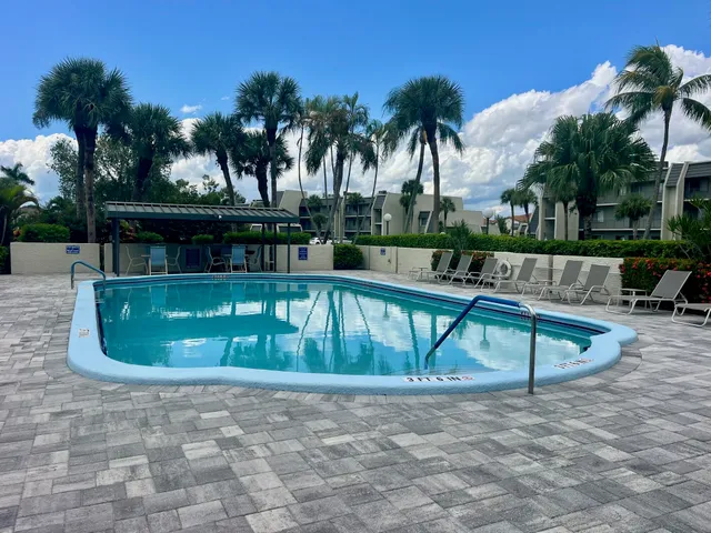 a view of swimming pool with a patio