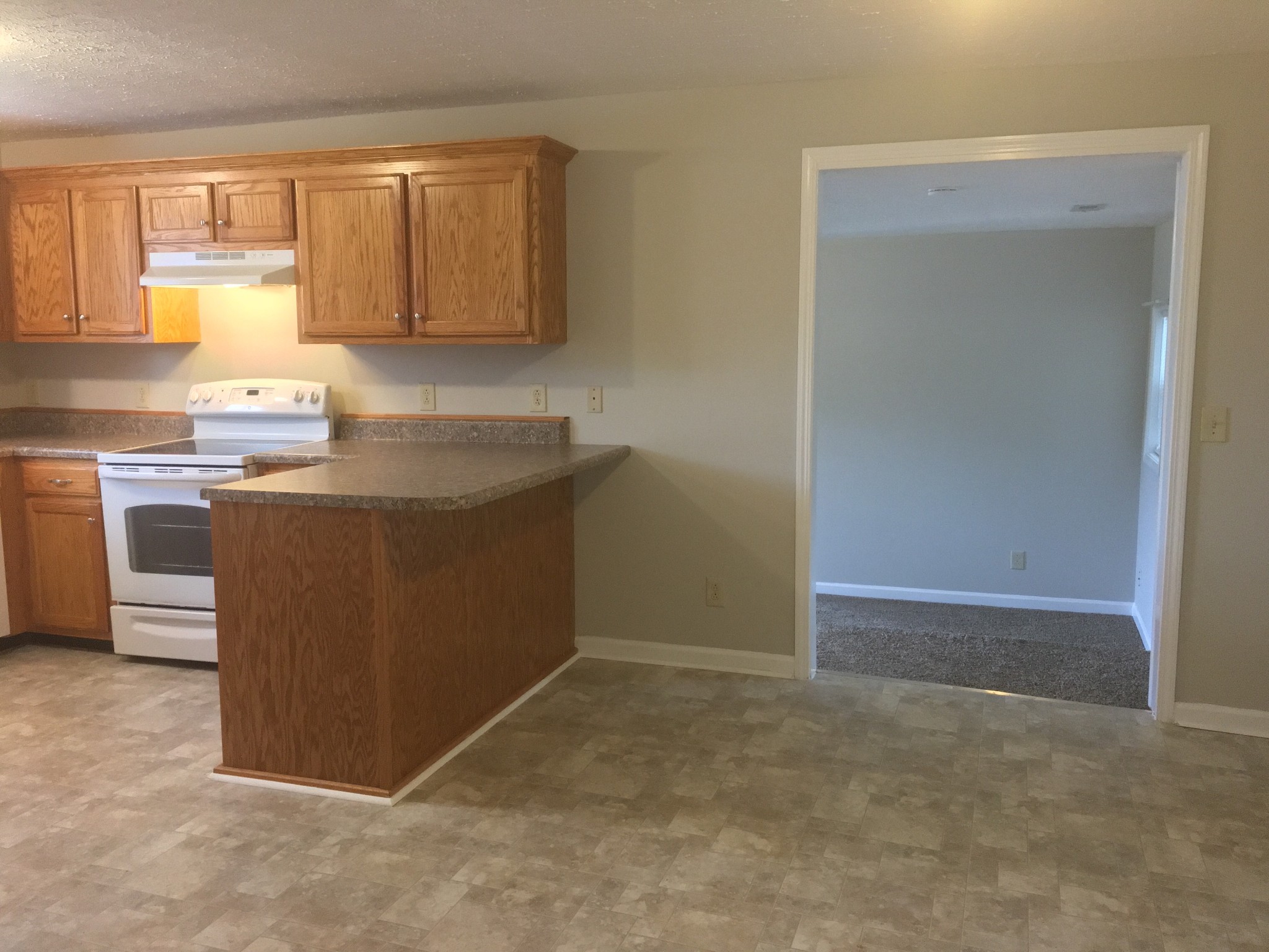 732 Yowell Avenue Madison, TN 37115 - Photo 4 of 17 a kitchen with stainless steel appliances granite countertop a stove a sink and a refrigerator