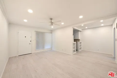 a kitchen with a sink stove and microwave