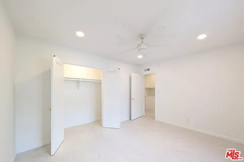 a bathroom with a bathtub sink and mirror