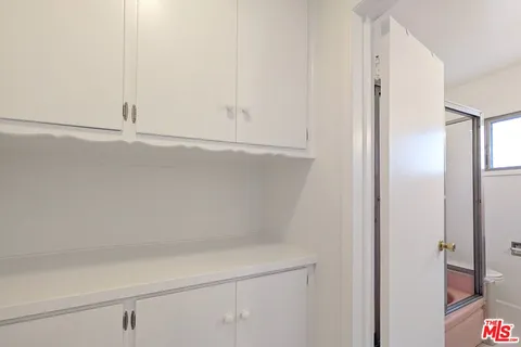 a backyard of a house with chairs