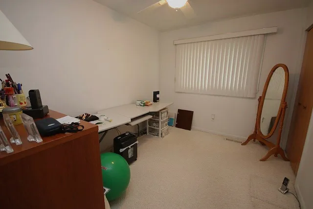 a room with gym equipment and a table
