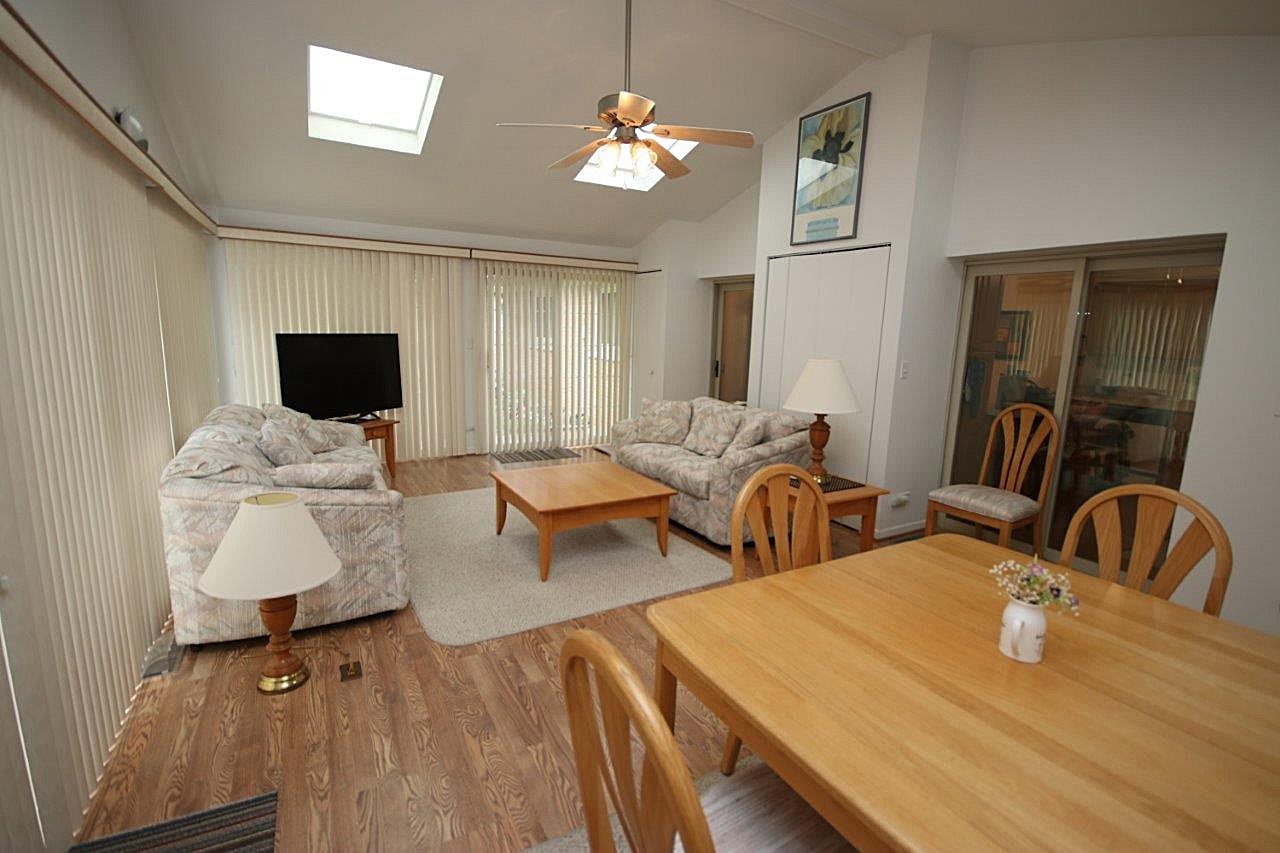 209 Gladys Avenue Fox River Grove, IL 60021 - Photo 2 of 23 a bedroom with two beds and a flat screen tv
