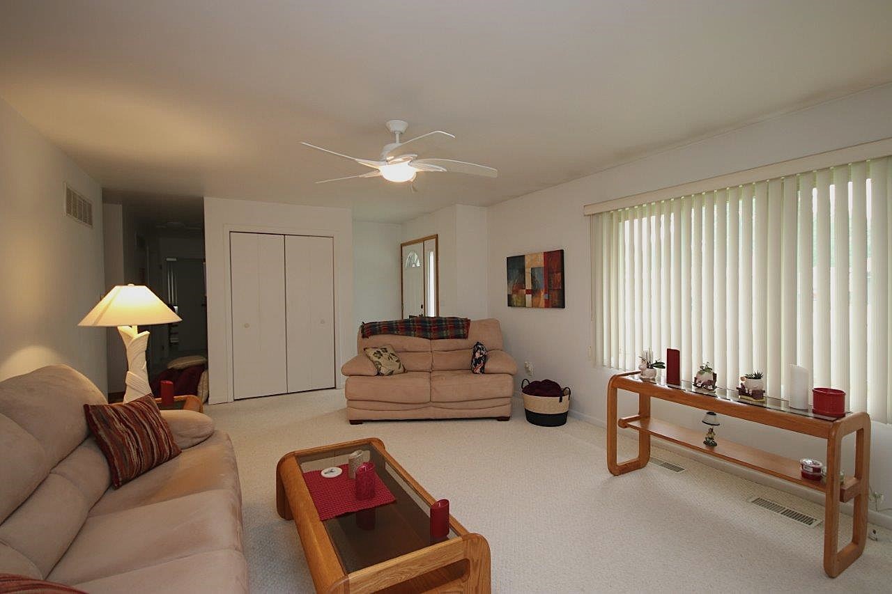 209 Gladys Avenue Fox River Grove, IL 60021 - Photo 6 of 23 a living room with furniture and a lamp
