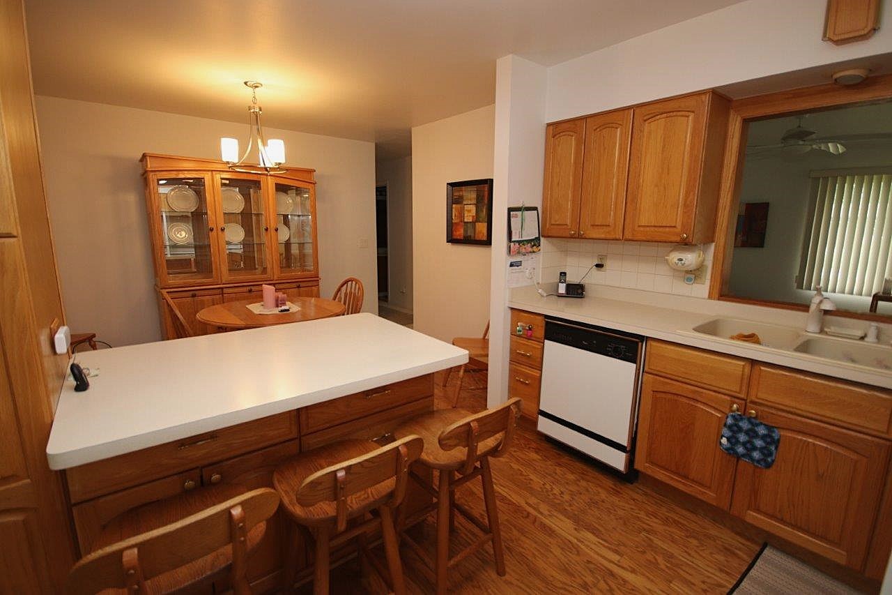 209 Gladys Avenue Fox River Grove, IL 60021 - Photo 7 of 23 a room with a sink and a mirror
