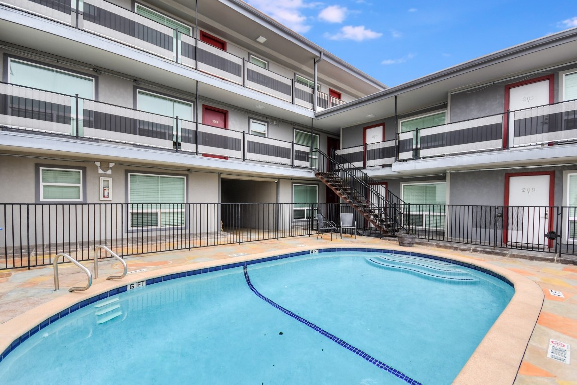 3110 Red River Street, Unit 221 Austin, TX 78705 - Photo 12 of 14 front view of a building with a swimming pool
