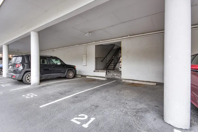 a view of parking area and car parked