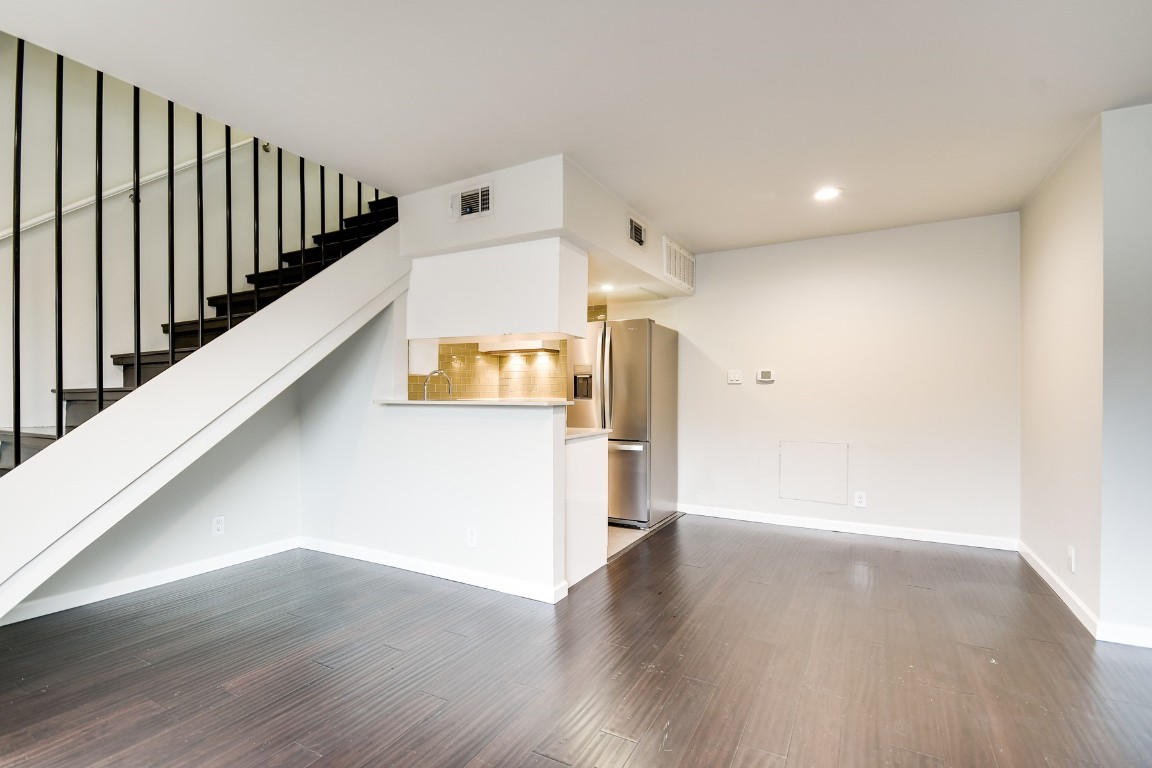 3110 Red River Street, Unit 221 Austin, TX 78705 - Photo 3 of 14 a view of a hallway with wooden floor
