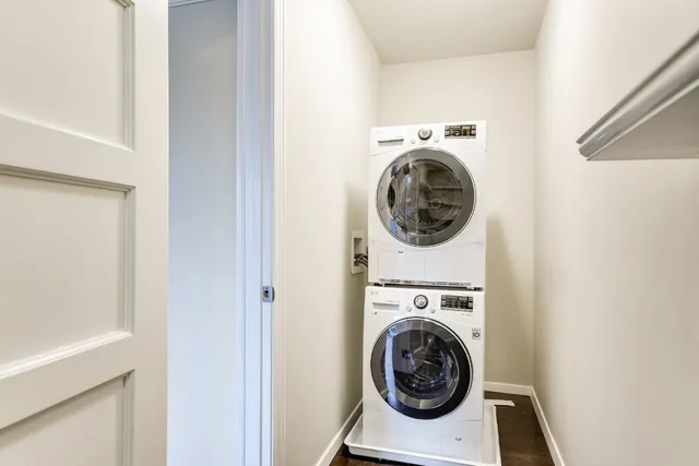a utility room with sink dryer and washer