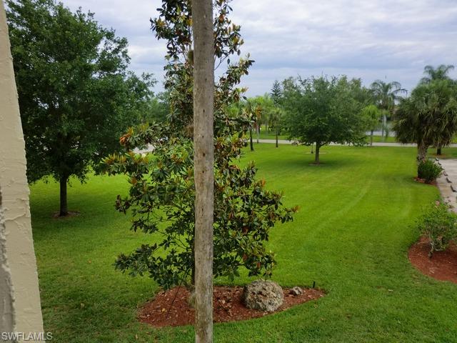 4372 27th Court Southwest, Unit 210 Naples, FL 34116 - Photo 18 of 19 a view of a garden