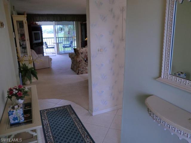 4372 27th Court Southwest, Unit 210 Naples, FL 34116 - Photo 4 of 19 a bathroom with a sink toilet and window