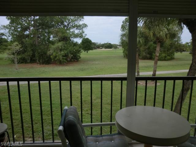 4372 27th Court Southwest, Unit 210 Naples, FL 34116 - Photo 8 of 19 a view of a balcony with furniture