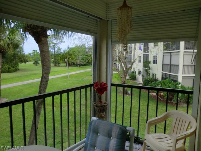 4372 27th Court Southwest, Unit 210 Naples, FL 34116 - Photo 9 of 19 a view of a two chairs in the balcony