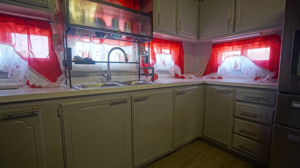 93 Grochmal Avenue, Unit 126 Springfield, MA 01151 - Photo 24 of 35 a kitchen with a sink and a large window